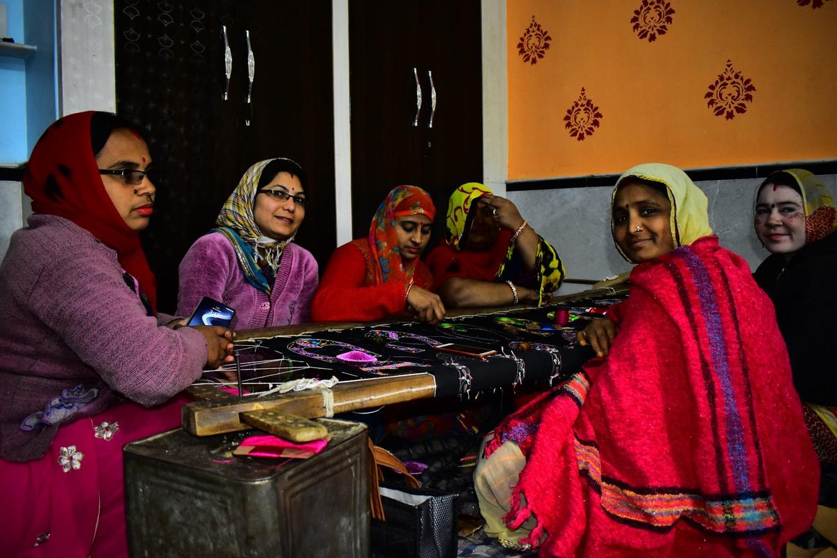 Woman working on sewing machine